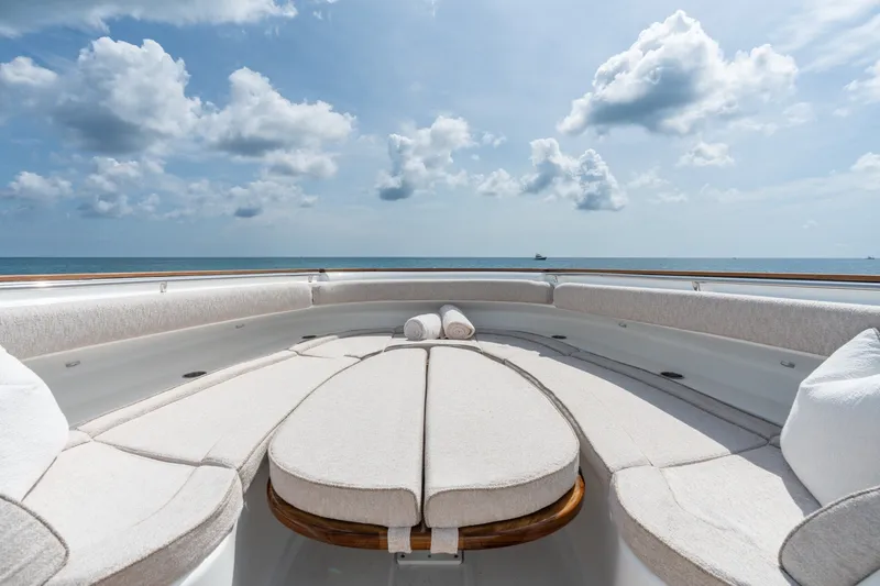 Slide: The Image of Luxurious seating area on 2023 HCB 65 Estrella yacht under a clear blue sky. - 21