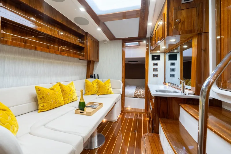 Slide: The Image of Luxurious interior of 2023 HCB 65 Estrella yacht with elegant wood finishes and plush seating. - 29