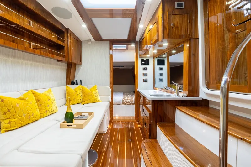 Slide: The Image of Luxurious interior of 2023 HCB 65 Estrella yacht with elegant wood finishes and plush seating. - 28