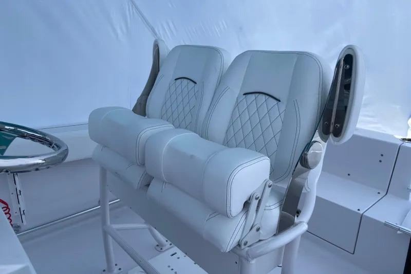 Slide: The Image of 2027 Sportsman Heritage 231 Center Console boat with luxurious white seating. - 3