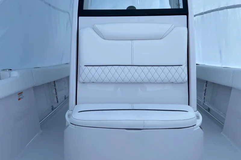 Slide: The Image of 2027 Sportsman Heritage 231 Center Console interior with white cushioned seating. - 7