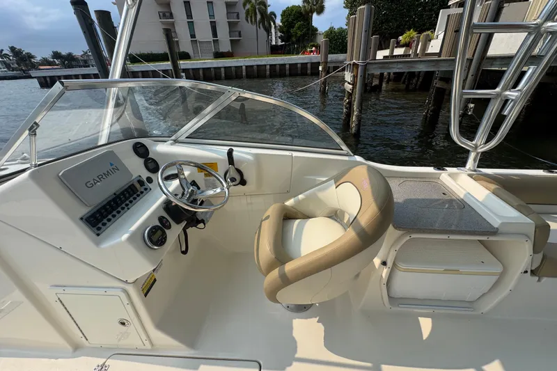Slide: The Image of 2019 Key West 239 DFS boat interior with Garmin navigation system and comfortable seating. - 5