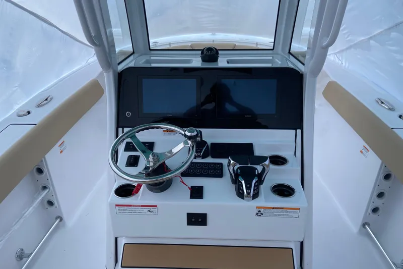 Slide: The Image of 2027 Sportsman Heritage 261 Center Console helm with modern controls and dual screens. - 5