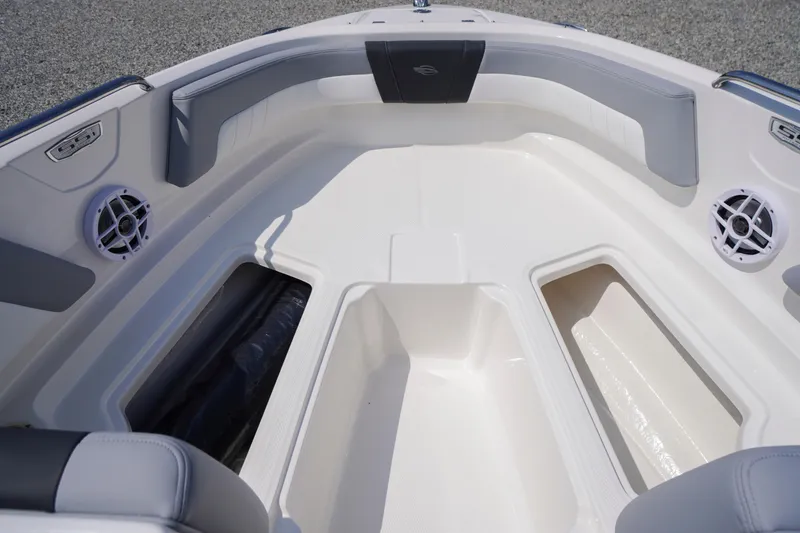 Slide: The Image of 2026 Chaparral 21 SSi OB boat interior with spacious seating and storage compartments. - 5