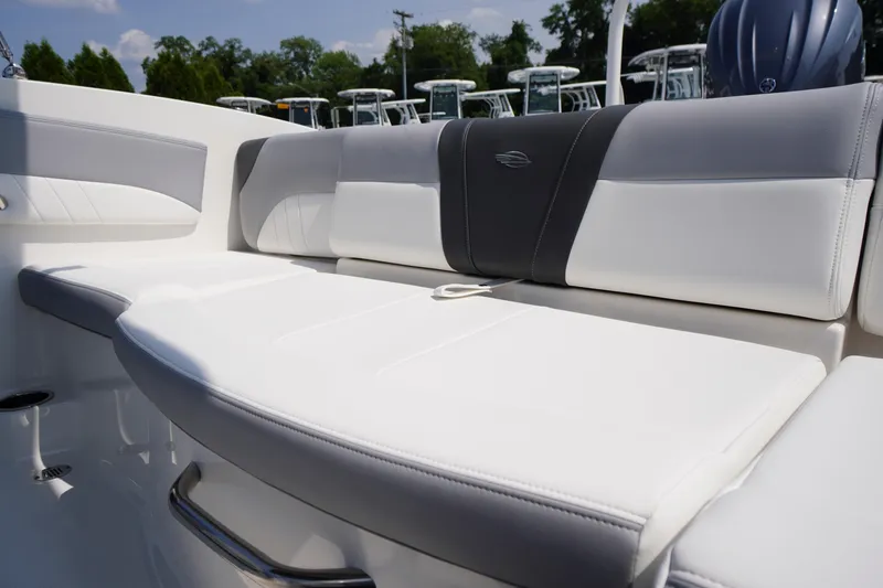 Slide: The Image of 2026 Chaparral 21 SSi OB boat interior with sleek white and gray seating. - 40