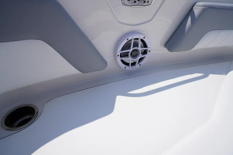 Slide: The Image of 2026 Chaparral 21 SSi OB boat interior with speaker and sleek design. - 6