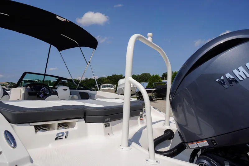 Slide: The Image of 2026 Chaparral 21 SSi OB boat with Yamaha outboard engine, featuring sleek design and spacious seating. - 45