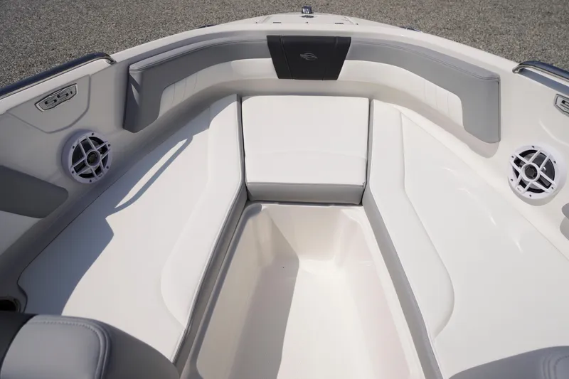 Slide: The Image of 2026 Chaparral 21 SSi OB boat interior with cushioned seating and built-in speakers. - 4