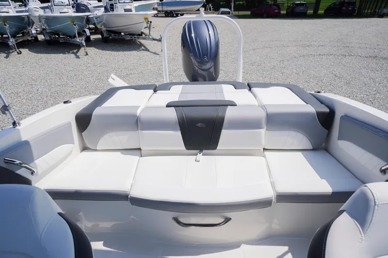 Slide: The Image of 2026 Chaparral 21 SSi OB boat interior with white and gray seating. - 31