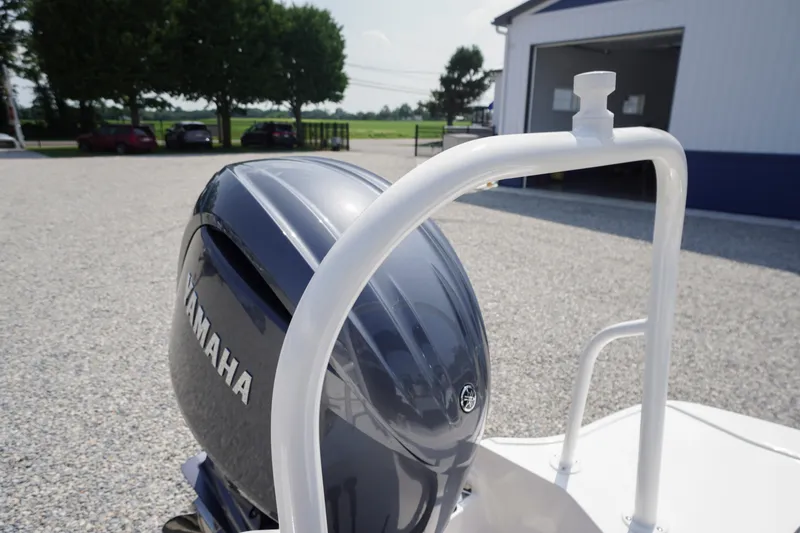 Slide: The Image of 2026 Chaparral 21 SSi OB with Yamaha outboard engine in a sunny outdoor setting. - 44