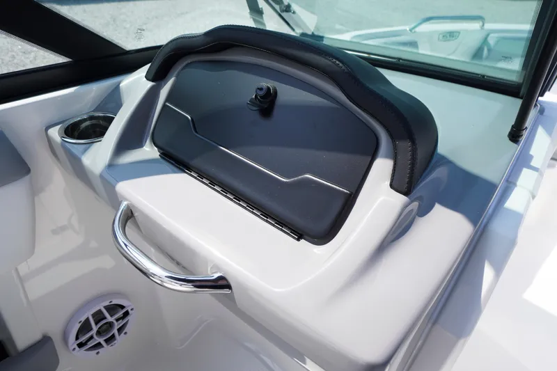 Slide: The Image of 2026 Chaparral 21 SSi OB boat dashboard with cup holder and speaker. - 19