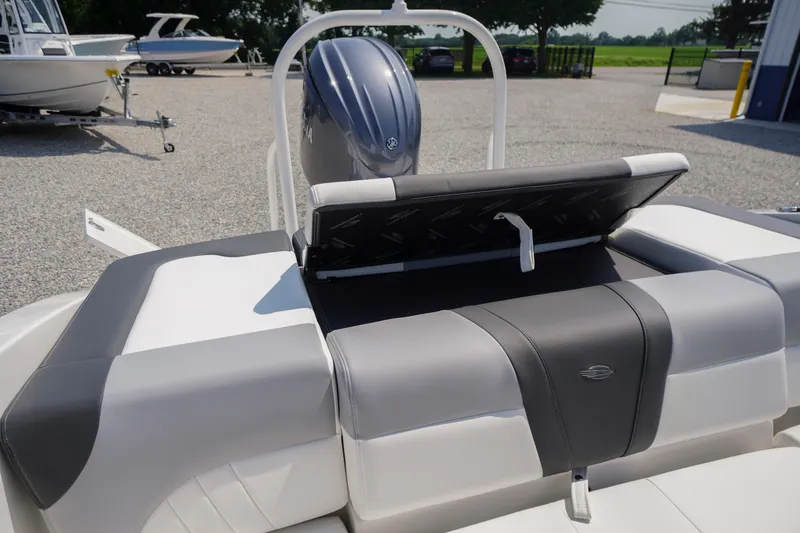 Slide: The Image of 2026 Chaparral 21 SSi OB boat with sleek seating and powerful outboard motor. - 38