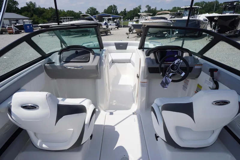 Slide: The Image of 2026 Chaparral 21 SSi OB boat interior with dual seating and modern dashboard. - 10