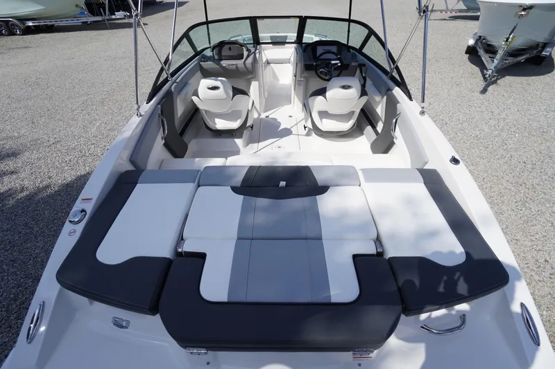 Slide: The Image of 2026 Chaparral 21 SSi OB boat interior with seating and steering wheel, viewed from above. - 43