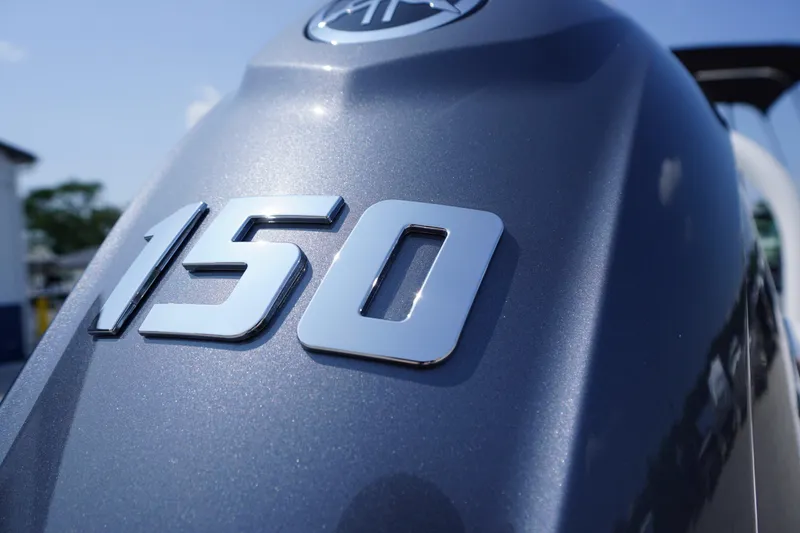 Slide: The Image of Close-up of Chaparral 21 SSi OB 2026 boat engine with "150" emblem. - 54