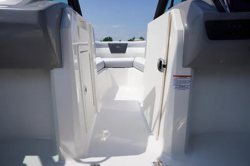 Slide: The Image of Interior view of 2026 Chaparral 21 SSi OB boat, featuring sleek seating and storage. - 26