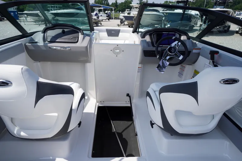Slide: The Image of Interior of 2026 Chaparral 21 SSi OB boat with modern seating and steering wheel. - 11