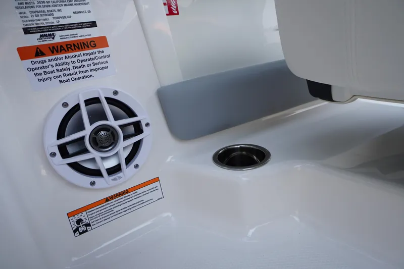 Slide: The Image of 2026 Chaparral 21 SSi OB boat interior with speaker and warning label. - 25