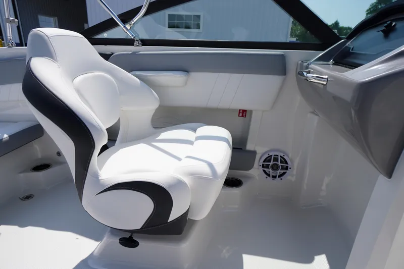 Slide: The Image of Interior of 2026 Chaparral 21 SSi OB boat featuring a sleek white captain's chair. - 27