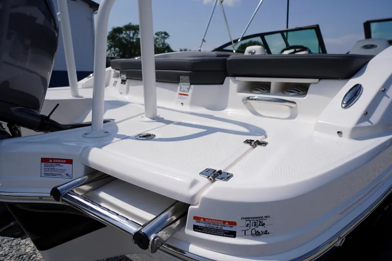 Slide: The Image of 2026 Chaparral 21 SSi OB boat deck with seating and safety warnings. - 50