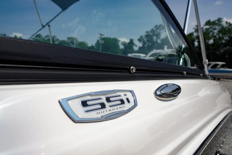 Slide: The Image of 2026 Chaparral 21 SSi OB boat, close-up of logo and sleek design. - 3