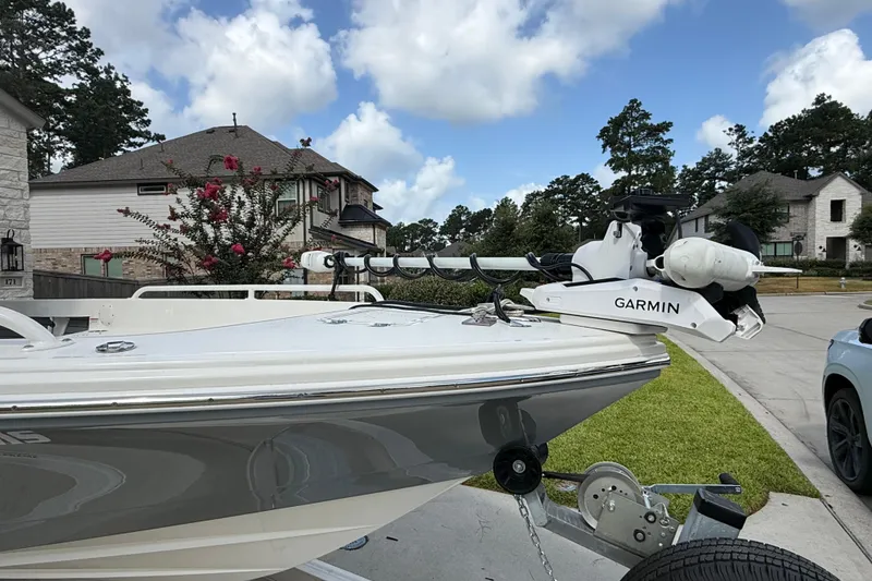 Slide: The Image of 2024 Pathfinder 2600 TRS boat with Garmin equipment, parked in a suburban driveway. - 4