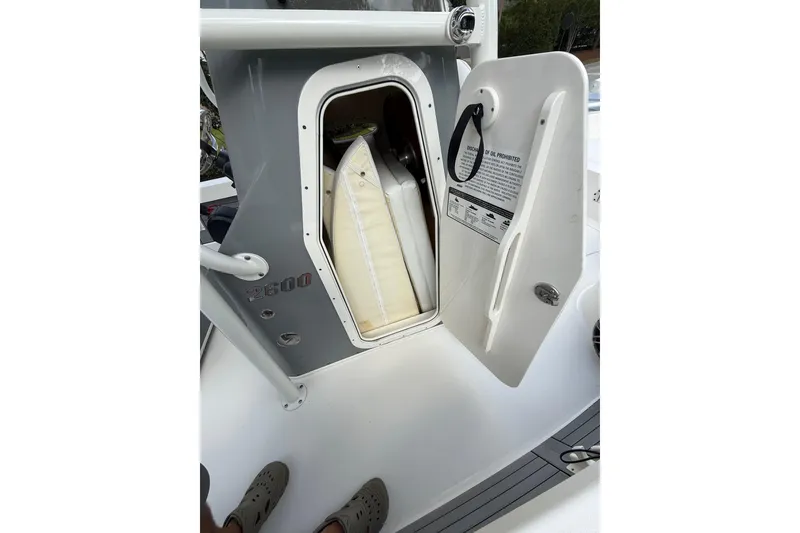 Slide: The Image of Open storage compartment on 2024 Pathfinder 2600 TRS boat, showcasing interior space and design. - 12
