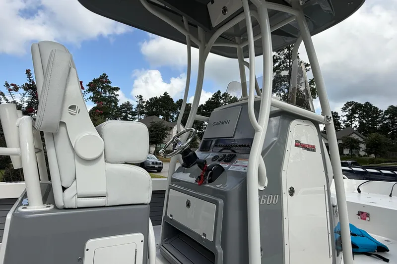 Slide: The Image of 2024 Pathfinder 2600 TRS boat console with Garmin navigation system and seating. - 3