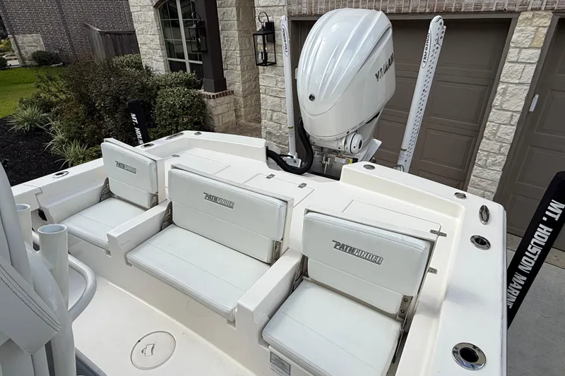 Slide: The Image of 2024 Pathfinder 2600 TRS boat with Yamaha engine, featuring white seating and sleek design. - 8