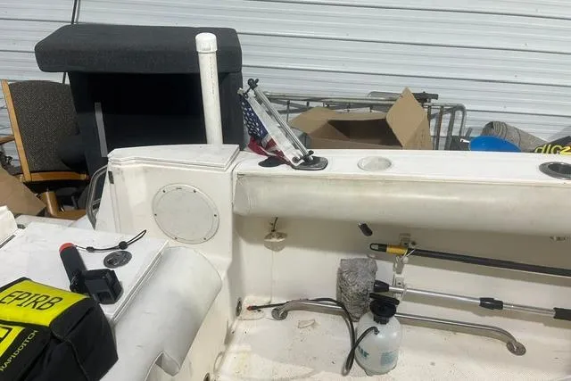 Slide: The Image of Interior of a 2005 Trophy 2502 Pro boat with fishing gear and equipment. - 11