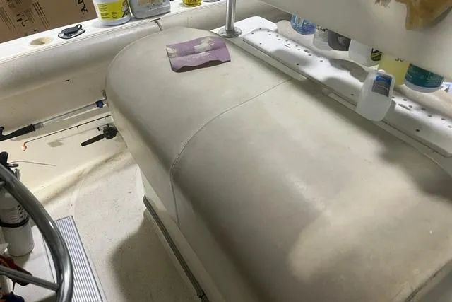 Slide: The Image of 2005 Trophy 2502 Pro boat interior with storage and fishing gear. - 9