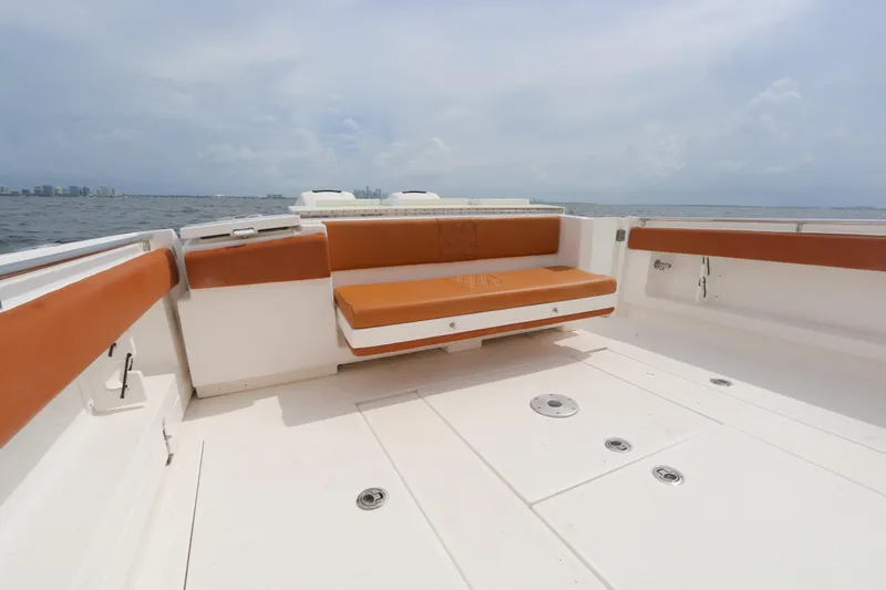 Slide: The Image of 2018 Belzona 327 Walkaround boat with spacious deck and orange seating. - 11