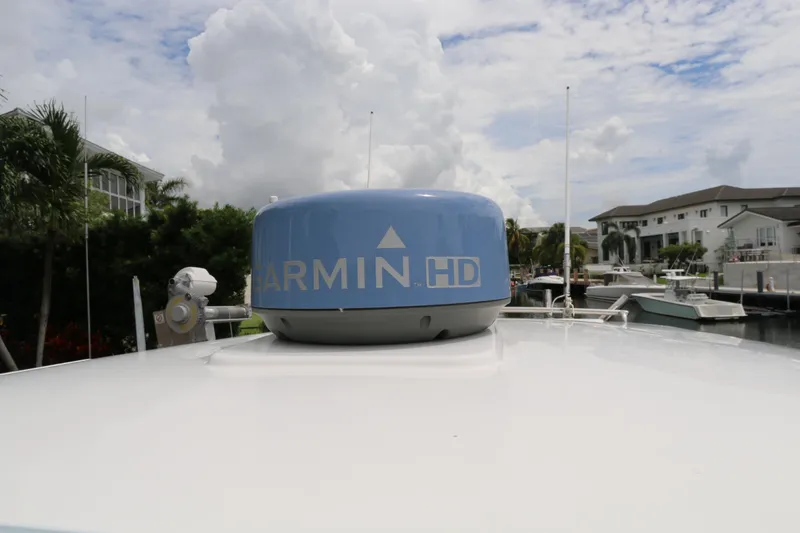 Slide: The Image of 2018 Belzona 327 Walkaround with Garmin HD radar, docked near waterfront homes. - 14