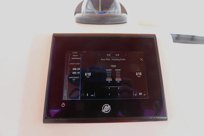 Slide: The Image of Display screen on 2018 Belzona 327 Walkaround showing autopilot and engine data. - 13