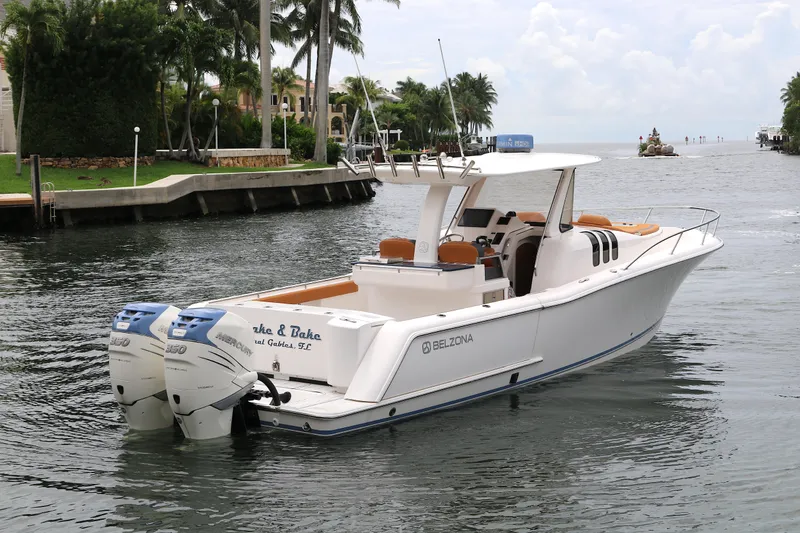 Slide: The Image of 2018 Belzona 327 Walkaround boat with twin engines on a scenic waterway. - 17