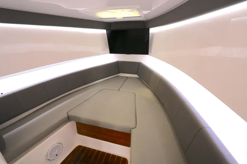 Slide: The Image of 2018 Belzona 327 Walkaround cabin interior with sleek seating and modern design. - 5