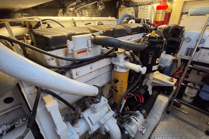Slide: The Image of Engine room of 2004 Tiara Yachts 4400 Sovran, showcasing mechanical components and equipment. - 42