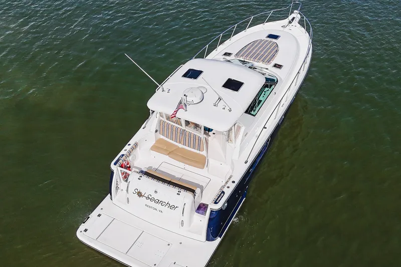 Slide: The Image of 2004 Tiara Yachts 4400 Sovran cruising on calm waters, aerial view. - 5