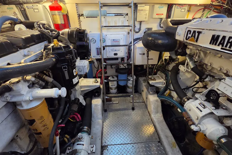 Slide: The Image of Engine room of 2004 Tiara Yachts 4400 Sovran, featuring CAT marine engines and equipment. - 41