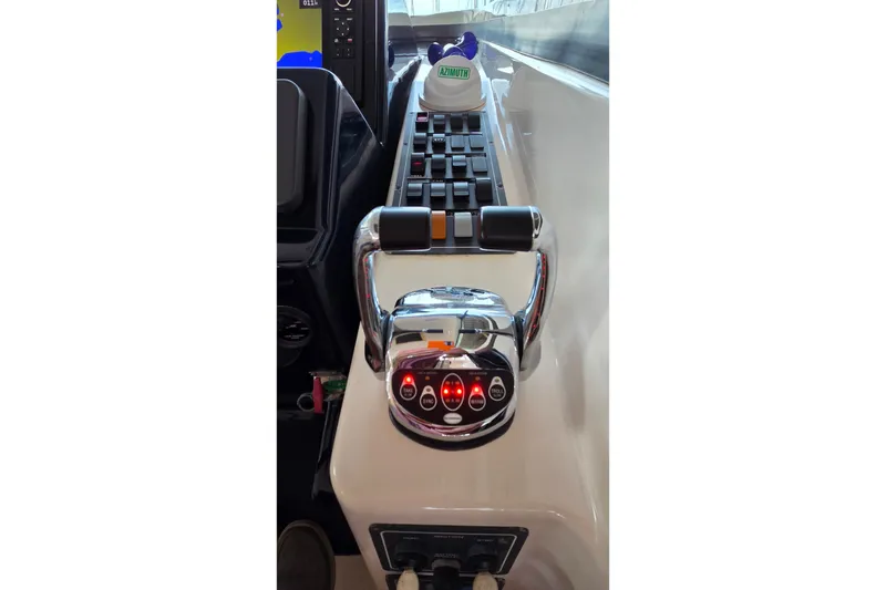Slide: The Image of Throttle controls on a 2004 Tiara Yachts 4400 Sovran, showcasing sleek design and functionality. - 23