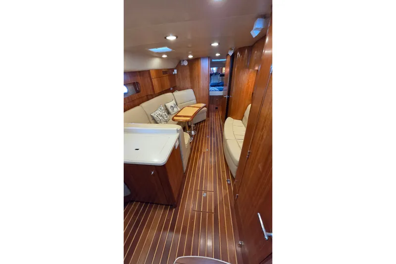 Slide: The Image of Luxurious interior of 2004 Tiara Yachts 4400 Sovran with elegant wood finish and cozy seating. - 26