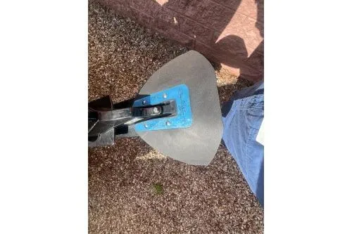 Slide: The Image of Close-up of a 2023 Sun Tracker Bass Buggy 18 DLX boat anchor on gravel. - 6