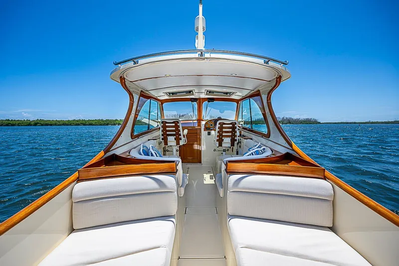 Slide: The Image of 2013 Hinckley Talaria 34 yacht interior with elegant seating on open water. - 6