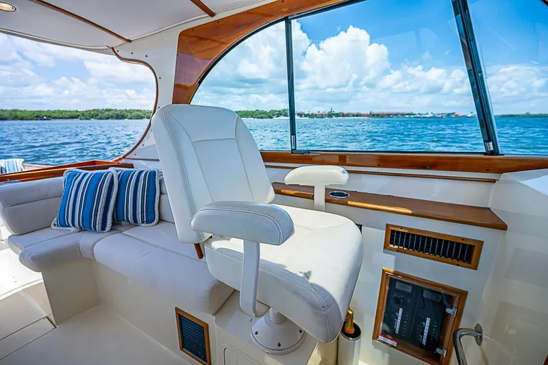 Slide: The Image of Luxurious interior of 2013 Hinckley Talaria 34 yacht with plush seating and ocean view. - 9
