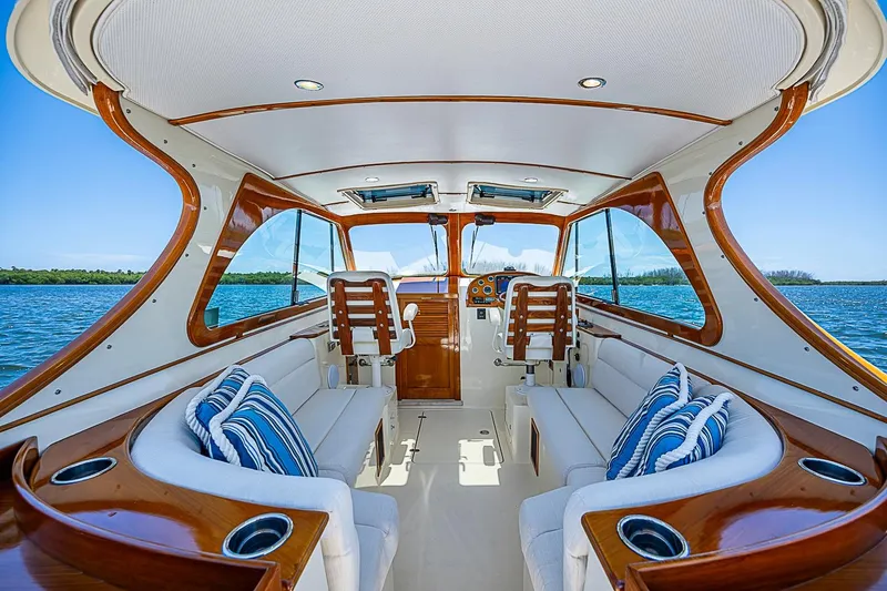 Slide: The Image of Interior of 2013 Hinckley Talaria 34 yacht with elegant seating and wooden accents. - 8