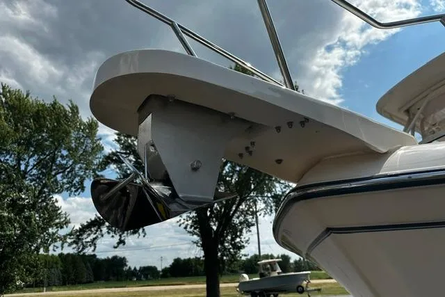 Slide: The Image of 2025 Grady-White Gulfstream 232 boat anchor detail against a cloudy sky backdrop. - 4