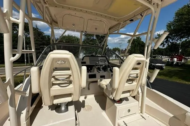 Slide: The Image of 2025 Grady-White Gulfstream 232 boat interior with dual captain seats and steering console. - 14