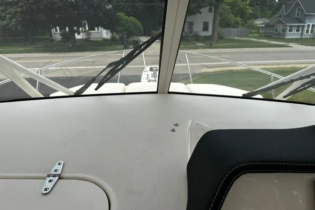 Slide: The Image of Interior view of 2025 Grady-White Gulfstream 232 boat, showcasing dashboard and windshield wipers. - 39