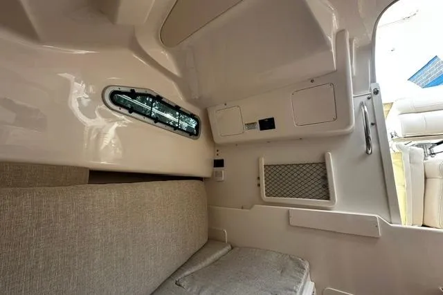 Slide: The Image of Interior cabin of 2025 Grady-White Gulfstream 232 boat, featuring seating and storage compartments. - 41