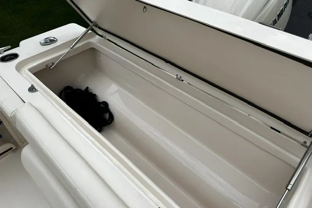Slide: The Image of Open storage compartment on 2025 Grady-White Gulfstream 232 boat, showcasing spacious interior. - 16